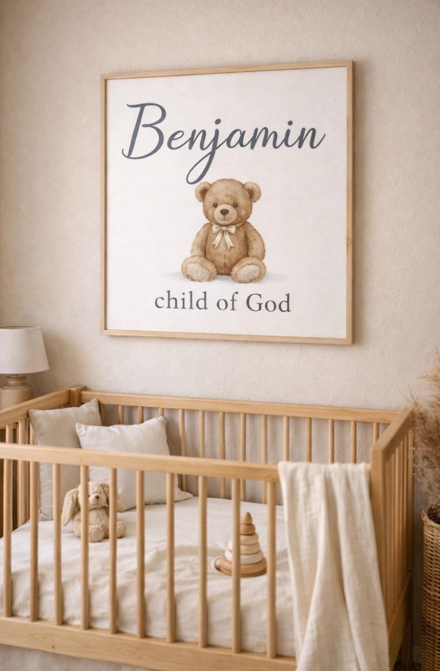 A cozy nursery with a light wooden crib, a soft toy bear, a lamp, and neutral décor. Above the crib hangs a sign with a teddy bear illustration and the words Benjamin, child of God.
